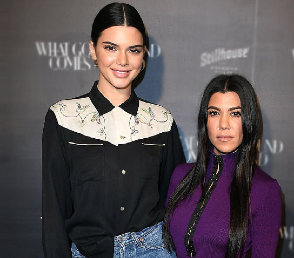 Kourtney Kardashian and Kendall Jenner wore contrasting swimsuits.
